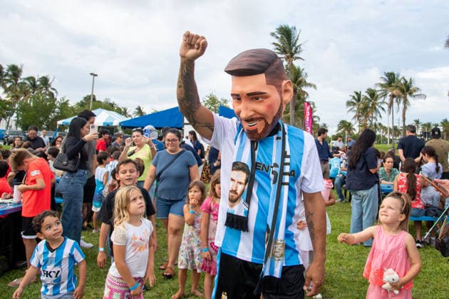 MIAMI, FL - JUNE 09: A person dressed to look like Lionel Messi wearing an Argentina national team, Nationalteam jersey interacts with event attendees on June 9, 2026 at Haulover Park, in Miami, FL. The Food Trucks Tuesdays event at Haulover Park is a weekly free admission community event featuring local food vendors, family-friendly activities, music, and kite flying. Recent events include Panini FIFA World Cup, WM, Weltmeisterschaft, Fussball 2026 Sticker trading, with a goal of helping collectors fill their albums. The performer dressed like Lionel Messi was introduced to attendees as a surprise guest visiting ahead of the 2026 FIFA World Cup. (Photo by Erica Denhoff Icon Sportswire) SOCCER: JUN 09 Food Trucks Tuesdays at Haulover Park EDITORIAL USE ONLY Icon260906
