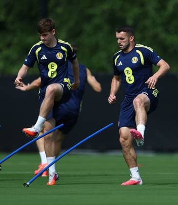 Findlay Curtis and John McGinn of Scotland Scotland Training Session and press conference, PK, Pressekonferenz 2026 FIFA World Cup, WM, Weltmeisterschaft, Fussball Football, Atrium Health Performance Park, Charlotte, USA - 10 Jun 2026Charlotte Atrium Health Performance Park United States of America EDITORIAL USE ONLY No use with unauthorised audio, video, data, fixture lists, club league logos or live services. Online in-match use limited to 120 images, no video emulation. No use in betting, games or single club league player publications.  Copyright: xMichaelxZemanek Shutterstockx 16919987be