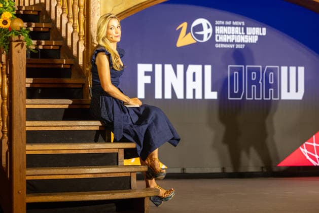 Andrea Kaiser sitting on the stairs Handball World Cup 2027 Draw , Handball, World Cup, Draw, 2027, 10.06.2026, Hofbraeuhaus Munich Hofbraeuhaus Munich Germany Copyright: xFootxBowl BjörnxKeckerx