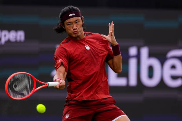 ROSMALEN, NETHERLANDS - JUNE 11: Zhizhen Zhang of China plays a forehand in his Men s Singles Second Round match against Tallon Griekspoor of the Netherlands during Day 4 of the Libema Open Grass Court Championships at the Autotron on June 11, 2026 in Rosmalen, Netherlands.  Copyright: xRenexNijhuis MBxMediax