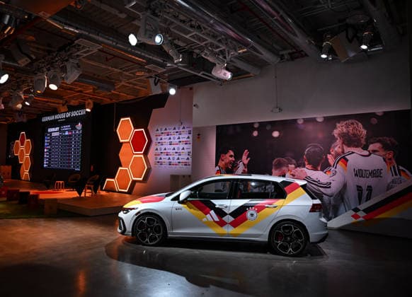 Football FIFA World Cup 2026 11 06 2026 German House of Soccer in Manhattan New York, Pre Opening at the opening match of the World Cup 2026, Mexico South Africa, interior view, advertising partner VW exhibits a GTI in jersey driving