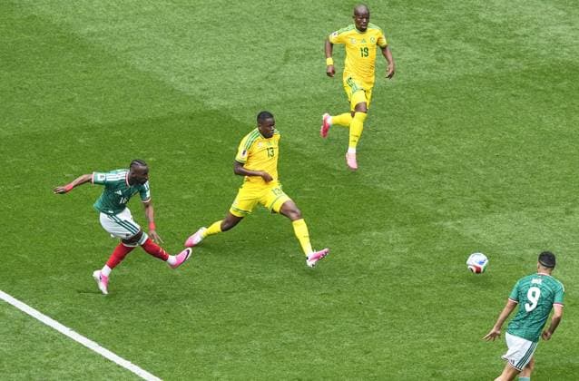 Fußball, FIFA WM 2026, Mexiko - Südafrika #5 Football: 2026 World Cup Mexico s Julian Quinones (far L) opens the scoring in the first half of the World Cup opener against South Africa at Mexico City Stadium in the Mexican capital on June 11, 2026.  A14AA0005618456P