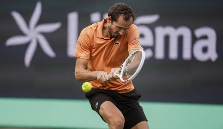 S-HERTOGENBOSCH, NETHERLANDS - JUNE 12: Daniil Medvedev plays a backhand against Thijs Boogaard of the Netherlands during their ATP, Tennis Herren Singles match at the LibÃ ma Open on June 12, 2026 at Autotron s-Hertogenbosch in s-Hertogenbosch, Netherlands. Credit: Andy Astfalck NurPhoto Netherlands Copyright: xAndyxAstfalckx