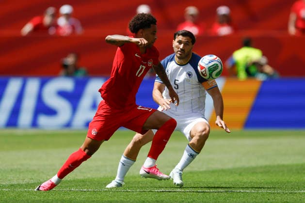 Tajon Buchanan (L) of Canada vies for the ball with Sead Kolasinac of Bosnia and Herzegovina in a Group B match of the 2026 FIFA World Cup, WM, Weltmeisterschaft, Fussball between Canada and Bosnia and Herzegovina at BMO Field in Toronto,Canada, 12 June 2026. Fifa World Cup 2026 - Group B - Canada vs Bosnia and Herzegovina !ACHTUNG: NUR REDAKTIONELLE NUTZUNG!  Copyright: xBienvenidoxVelascox GR5162 20260612-55020580318_1