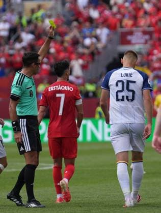 Canada v Bosnia and Herzegovina - FIFA World Cup, WM, Weltmeisterschaft, Fussball 2026 - Group B TORONTO, CANADA - JUNE 12: Referee Facundo Tello shows a yellows card to Jovo Lukic (25) of Bosnia and Herzegovina during the 2026 FIFA World Cup First Stage Group B match between Canada and Bosnia and Herzegovina at Toronto Stadium (BMO Field) in Toronto, Ontario, Canada on June 12, 2026. Mert Alper Dervis Anadolu Ontario Canada. Editorial use only. Please get in touch for any other usage.  Copyright: x2026xAnadoluxMertxAlperxDervisx