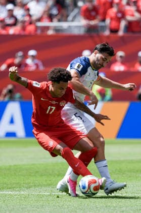 Tajon Buchanan of Canada (L) and Sead Kolasinac of Bosnia and Herzegovina (R) challenge for possession of the ball during a group stage match of the 2026 FIFA Men s World Cup between Canada and Bosnia and Herzegovina at Toronto Stadium in Toronto on June 12, 2026. Richard Callis Fotoarena (Richard Callis SPP)  Copyright: xRichardxCallisx xSPPx spp-en-RiCa-2960738