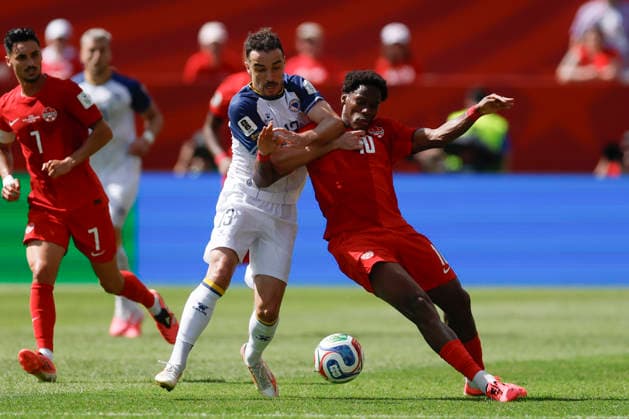 Jonathan David (R) of Canada vies for the ball with Ivan Basic of Bosnia and Herzegovina in a Group B match of the 2026 FIFA World Cup, WM, Weltmeisterschaft, Fussball between Canada and Bosnia and Herzegovina at BMO Field in Toronto,Canada, 12 June 2026. Fifa World Cup 2026 - Group B - Canada vs Bosnia and Herzegovina !ACHTUNG: NUR REDAKTIONELLE NUTZUNG!  Copyright: xBienvenidoxVelascox GR5203 0859023397st