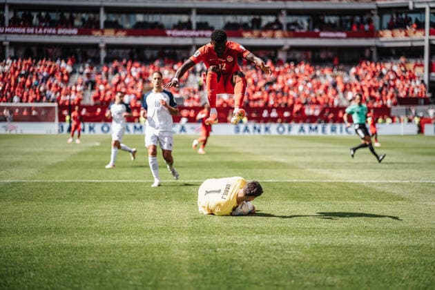 Soccer Men FIFA World Cup 2026 Group B Canada vs Bosnia and Herzegovina 12 06 2026 Tani Oluwaseyi 12, Canada top jumps over Nikola Vasilj 1, Bosnia and Herzegovina bottom Toronto Toronto Stadium Ontario Canada