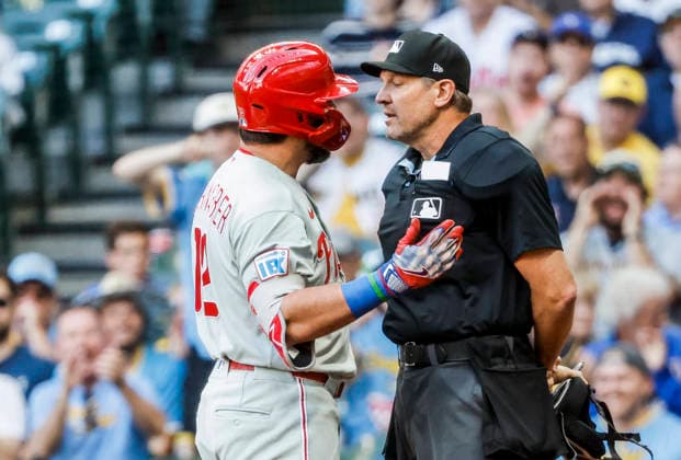 Philadelphia Phillies designated hitter Kyle Schwarber argues with home plate umpire Chad Fairchild after being called out on strikes in the first inning of the MLB, Baseball Herren, USA game between the Philadelphia Phillies and the Milwaukee Brewers at American Family Field in Milwaukee, Wisconsin on Friday, June 12, 2026.  MIL20260612807 TANNENxMAURY