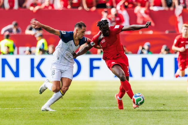TORONTO, ON - JUNE 12: Defender Nikola KatiÄ‡ (18) of Bosnia and Herzegovina and forward Promise David (24) of Canada are seen during the second half of the FIFA World Cup, WM, Weltmeisterschaft, Fussball 2026 Group B match between Canada and Bosnia and Herzegovina on June 12, 2026, at Toronto Stadium in Toronto, ON. (Photo by Mathew Tsang Icon Sportswire) SOCCER: JUN 12 FIFA World Cup 26 Group B - Canada vs Bosnia and Herzegovina EDITORIAL USE ONLY Icon260612019