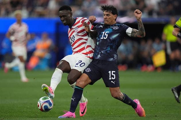 FIFA World Cup, WM, Weltmeisterschaft, Fussball 2026 - Group D - USA vs Paraguay Folarin Balogun of USA (L) in action against Gustavo Gomez of Paraguay (R) during the FIFA World Cup 2026 group stage match USA against Paraguay, in Los Angeles, California, USA, 12 June 2026. LOS ANGELES United States  Copyright: xSCOTTxSTRAZZANTEx