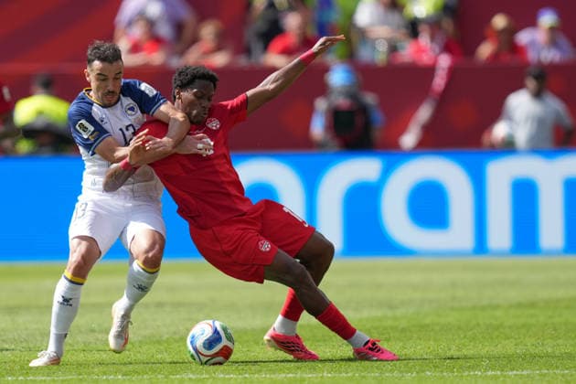 Canada v Bosnia and Herzegovina - 2026 FIFA World Cup, WM, Weltmeisterschaft, Fussball Ivan BASIC 13 of Bosnia and Herzegovina and Jonathan DAVID 10 of Canada battle for the ball forward during the 2026 FIFA World Cup Group B match between Canada and Bosnia and Herzegovina at Toronto Stadium. on June 12, 2026 in Toronto, Canada. (Photo by Leonardo Ramirez Eyepix Group) Copyright: xLeonardoxRamirezx xEyepixxGroupx LR12062026-04819