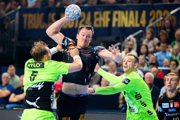 Cologne, Germany Handball EHF CL Final 4 Semifinal SC Magdeburg Fuechse Berlin from left in duel Max Darj Berlin and Felix Claar Magdeburg , Mathias Gidsel Berlin Cologne Lanxess Arena Nordrhein Westfalen Germany