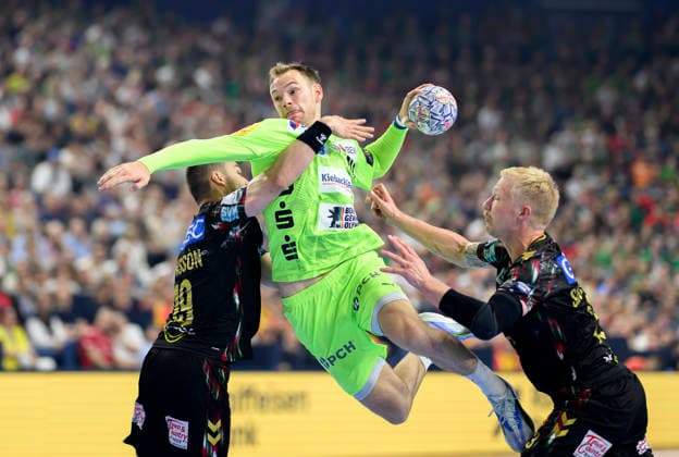f l Elvar Oern Jonsson SCM , Mathias GIDSEL B , Magnus SAUGSTRUP SCM , throw, action, duel semi-final SC Magdeburg MD vs Füchse Berlin, on 13 06 2026 Men Handball EHF Champions League Final4 2026, from 13 06 14 06 2026 in Cologne Germany Lanxess Arena
