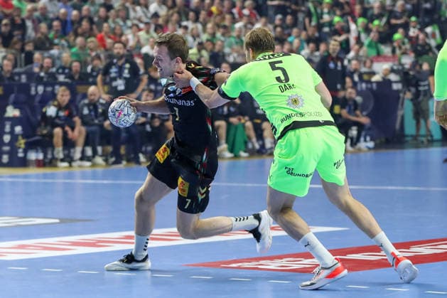 13 06 2026, xgox, handball EHF Champions League semi-final SC Magdeburg Füchse Berlin v l Felix Claar Magdeburg, 7 , Max Darj Berlin, 5 duel, duel, fight, tackle Köln