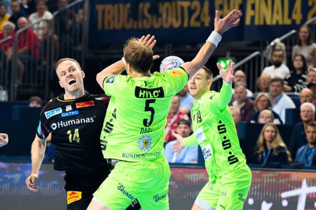 Cologne, Germany Handball EHF CL Final 4 Semi-Final SC Magdeburg Fuechse Berlin from left Omar Ingi Magnusson SC Magdeburg , Max Darj Berlin , Mathias Gidsel Berlin Cologne Lanxess Arena Nordrhein Westfalen Germany