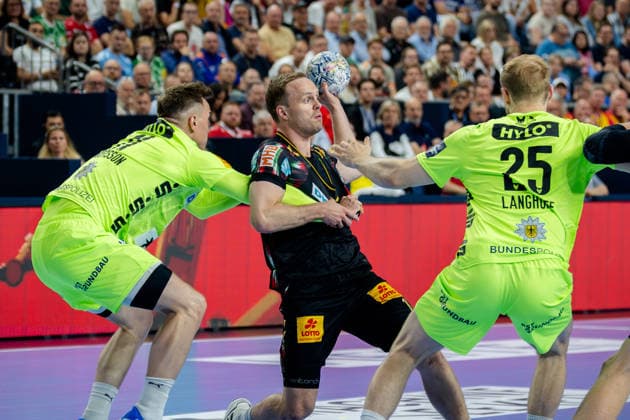 Cologne, 12 05 2026, Handball, Men, EHF Champions League Men 2025 26, Semi-final, SC Magedeburg Füchse Berlin Omar Ingi Magnusson SC Magdeburg, 14 in duel with Lasse Bredekjaer Andersson Füchse Berlin, 11