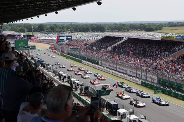 Kevin Magnussen DE , Dries Vanthoor BEL Raffaele Marciello SUI BMW M Hybrid V8 15 leads the hypercar field to the start of the 24 Hours of Le Mans, France, WEC World Endurance Championship, 13 06 2026,
