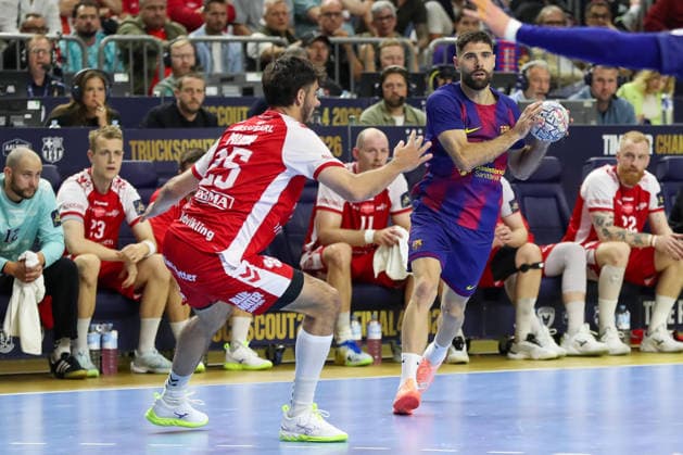 13 06 2026 ,xgox, Handball EHF Champions League semi-final Aalborg Handbold FC Barcelona emspor, v l Marinus Munk Aalborg, 25 , Blaz Janc Barcelona, 18 duel, duel, fight, tackle Köln