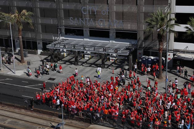 SANTA CLARA, CA - JUNE 13: Fans from Switzerland walks towards the stadium in front of a parking garage with City of Santa Clara before the FIFA World Cup, WM, Weltmeisterschaft, Fussball 2026 Group B match between Qatar and Switzerland on June 13, 2026 at San Francisco Bay Area Stadium in Santa Clara, CA. (Photo by Matthew Huang Icon Sportswire) SOCCER: JUN 13 FIFA World Cup 26 Group B - Qatar vs Switzerland EDITORIAL USE ONLY Icon260613003