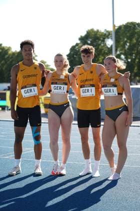 Philip Stroh ASC Darmstadt poses together with three other German athletes in Germany jerseys for a group photo on the tartan track The four starters of the German 4x100m relay GER I stand next to each other at the meeting in Mannheim 2026 Philip Stroh and German 4x100m team at the 32 Bauhaus Junior Gala Mannheim Copyright: xspeedshotx xAntoinexdexPadouxIzerexShimax