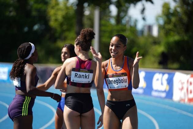 Joy Umegbolu 335, Switzerland gestures with a smile on the blue tartan track of the Michael Hoffmann Stadium, while Timea Rankl 326, Switzerland stands with her back to the camera Other athletes can be seen in the background Joy Umegbolu 335 and Timea Rankl 326 after the competition at the Bauhaus Junior Gala Mannheim Copyright: xspeedshotx xAntoinexdexPadouxIzerexShimax