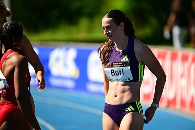 Xenia Buri Switzerland, 310 stands on the blue tartan track of the Michael Hoffmann Stadium in Mannheim after her run The name Buri and the words Mannheim 2026 can be read on her bib number Xenia Buri 310 at the Junior Gala Mannheim 2026 Copyright: xMichaelxGelhardtx