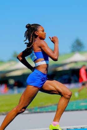Shade Laporal 162 from France runs in full stride on the tartan track of the Michael Hoffmann Stadium in Mannheim The athlete is seen from the side and shows a powerful running movement Shade Laporal 162 during the 400m run in the Michael Hoffmann Stadium Mannheim Copyright: xspeedshotx