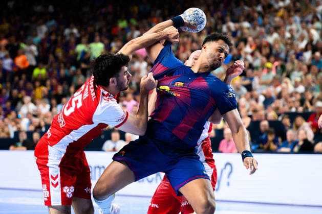Cologne, Germany Handball EHF CL Final 4 semi-final Aalborg Handbold Barca v li in duel Marinus Grandahl Munk Aalborg and Timothey N guessan Barcelona Cologne Lanxess Arena Nordrhein Westfalen Germany