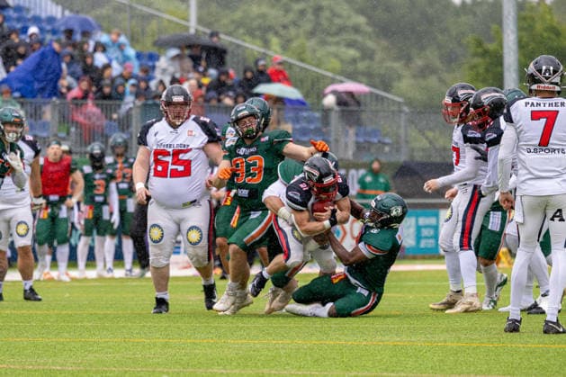 13 06 2026 American Football German Football League 2026 Kiel Baltic Hurricanes Düsseldorf Panther Kiel in green, Düsseldorf in white Center F l n r Yannic Kiesewetter, Tieu Long Otte hidden , GenÂnaÂdiy Adams, Robert Revels III Kiel Kilia Stadion, Hasseldieksdammer Schleswig Holstein Germany