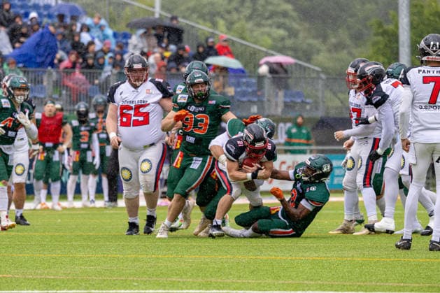 13 06 2026 American Football German Football League 2026 Kiel Baltic Hurricanes Düsseldorf Panther Kiel in green, Düsseldorf in white Center F l n r Yannic Kiesewetter, Tieu Long Otte hidden , GenÂnaÂdiy Adams, Robert Revels III Kiel Kilia Stadion, Hasseldieksdammer Schleswig Holstein Germany