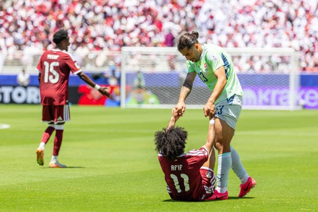 SANTA CLARA, CA - JUNE 13: Ricardo Rodriguez 13 of Switzerland helps Akram Afif 11 of Qatar up during the FIFA World Cup, WM, Weltmeisterschaft, Fussball 2026 Group B match between Qatar and Switzerland on June 13, 2026 at San Francisco Bay Area Stadium in Santa Clara, CA. (Photo by Matthew Huang Icon Sportswire) SOCCER: JUN 13 FIFA World Cup 26 Group B - Qatar vs Switzerland EDITORIAL USE ONLY Icon260613017