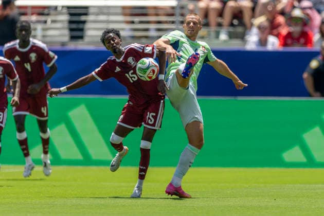 SANTA CLARA, CA - JUNE 13: Yusuf Abdurisag 15 of Qatar and Nico Elvedi 4 of Switzerland fight for the ball during the first half of the FIFA World Cup, WM, Weltmeisterschaft, Fussball 2026 Group B match between Qatar and Switzerland on June 13, 2026 at the San Francisco Bay Area Stadium in Santa Clara, CA. (Photo by Bob Kupbens Icon Sportswire) SOCCER: JUN 13 FIFA World Cup 26 Group B - Qatar vs Switzerland EDITORIAL USE ONLY Icon260613013