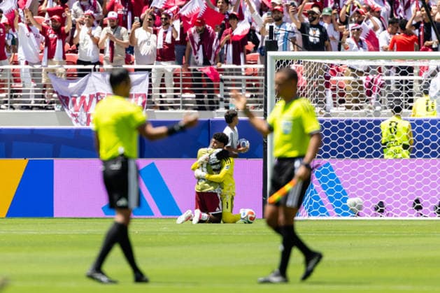 SANTA CLARA, CA - JUNE 13: Mahmud Abunada 1 of Qatar and a teammate hug after a tie in the FIFA World Cup, WM, Weltmeisterschaft, Fussball 2026 Group B match between Qatar and Switzerland on June 13, 2026 at San Francisco Bay Area Stadium in Santa Clara, CA. (Photo by Matthew Huang Icon Sportswire) SOCCER: JUN 13 FIFA World Cup 26 Group B - Qatar vs Switzerland EDITORIAL USE ONLY Icon260613030