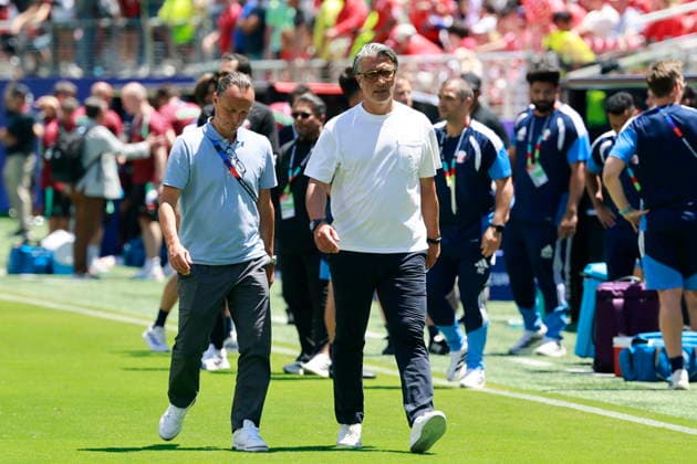 FIFA World Cup, WM, Weltmeisterschaft, Fussball 2026 - Group B - Qatar vs Switzerland Switzerland s head coach Murat Yakin (R) and Adrian Arnold, chief communication, leave the pitch after the FIFA World Cup 2026 group stage match Qatar against Switzerland, in San Francisco, USA, 13 June 2026. San Francisco United States  Copyright: xPETERxKLAUNZERx