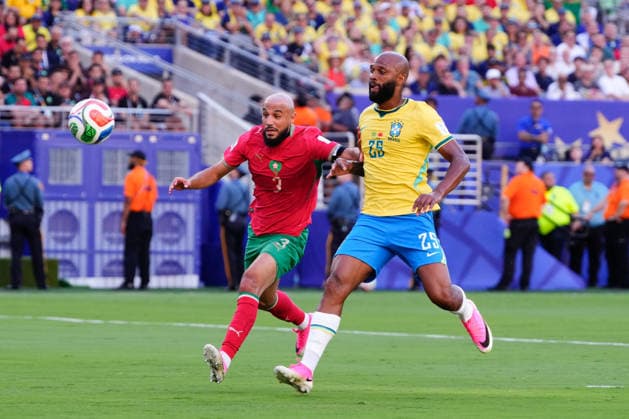 Brazil v Morocco - FIFA World Cup, WM, Weltmeisterschaft, Fussball 2026 - Group C NEW JERSEY, UNITED STATES - JUNE 13: Noussair Mazraoui (L) of Morocco and Igor Thiago (25) of Brazil compete for the ball during 2026 FIFA World Cup First Stage Group C match between Brazil and Morocco at MetLife (New Jersey Stadium) in East Rutherford, New Jersey, United States on June 13, 2026. Jose Hernandez Anadolu New Jersey United States. Editorial use only. Please get in touch for any other usage.  Copyright: x2026xAnadoluxJosexHernandezx