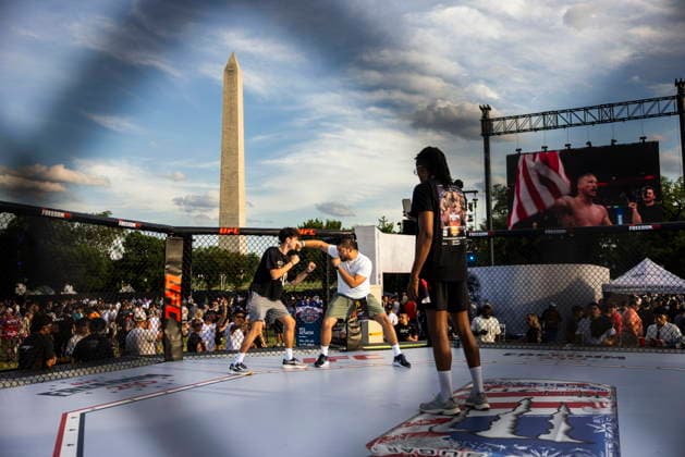 UFC Freedom 250 - Ceremonies Fans of ultimate fighting pose for a photo on the Ellipse outside of the White House ahead of the UFC Freedom 250 ceremonial weigh-ins in Washington, DC, USA, 13 June 2026. The martial arts bouts are scheduled to take place on the South Lawn of the White House on 14 June. WASHINGTON DC UNITED STATES  Copyright: xJIMxLOxSCALZOx xPOOLx