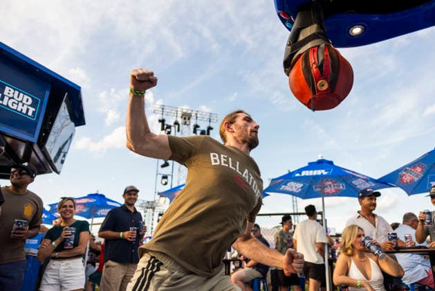 A fan of ultimate fighting hits a punching bag on the Ellipse outside of the White House ahead of the UFC Freedom 250 ceremonial weigh-ins in Washington DC on Saturday, June 13, 2026. The martial arts bouts are scheduled to take place on the South Lawn of the White House on June 14.  WAX20260613999 JIMxLOxSCALZO