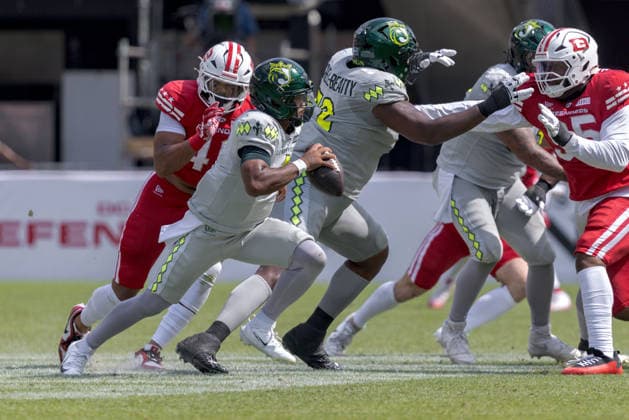 June 13, 2026, Washington, D.C, U.S: Louisville Kings quarterback Chandler Rogers (4) evades the rush from DC Defenders linebacker Micah Baskerville (44) during the United Bowl UFL Championship game at Audi Field, Washington, D.C. UFL 2026 - United Bowl -Kings 27:20 Defenders  - ZUMAs304 20260613_zaf_s304_022 Copyright: xScottxStuartx