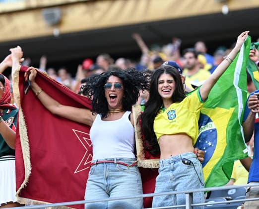EAST RUTHERFORD, NEW JERSEY - JUNE 13: A fan of Morocco and a fan of Brazil hold flags before the FIFA World Cup, WM, Weltmeisterschaft, Fussball 2026 Group C match between Brazil and Morocco at New York New Jersey Stadium on June 13, 2026 in East Rutherford, New Jersey.  Copyright: xMBxMediax