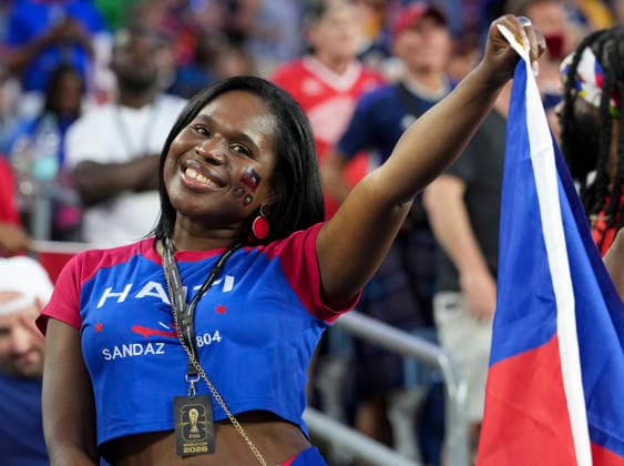 (260614) -- BOSTON, June 14, 2026 -- A fan of Haiti cheers before the group C match between Haiti and Scotland at the 2026 FIFA World Cup, WM, Weltmeisterschaft, Fussball at Boston Stadium in Boston, the United States, June 13, 2026. ) (SP)U.S.-BOSTON-FOOTBALL-FIFA WORLD CUP-GROUP C-HTI VS SCO ChenxYichen 