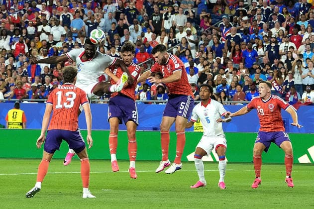 (260614) -- BOSTON, June 14, 2026 -- Frantzdy Pierrot (2nd L) of Haiti heads for the ball during the group C match between Haiti and Scotland at the 2026 FIFA World Cup, WM, Weltmeisterschaft, Fussball at Boston Stadium in Boston, the United States, June 13, 2026. ) (SP)U.S.-BOSTON-FOOTBALL-FIFA WORLD CUP-GROUP C-HTI VS SCO HuangxZongzhi 