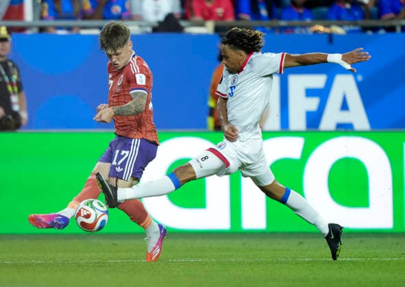 (260614) -- BOSTON, June 14, 2026 -- Ben Gannon-Doak (L) of Scotland vies with Martin Experience of Haiti during the group C match between Haiti and Scotland at the 2026 FIFA World Cup, WM, Weltmeisterschaft, Fussball at Boston Stadium in Boston, the United States, June 13, 2026. ) (SP)U.S.-BOSTON-FOOTBALL-FIFA WORLD CUP-GROUP C-HTI VS SCO ChenxYichen 