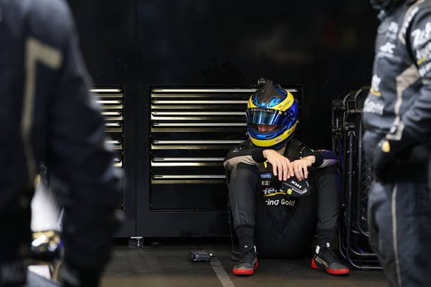 Sebastian Bourdias FRA Cadillac V Series R 12 sits with helmet on disappointed on the ground after a stop due to a technical defect in the pits, 24 Hours of Le Mans, France, WEC World Endurance Championship, 14 06 2026, problem with the leading race car until then