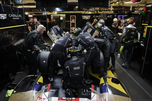 Many team members are working on the Cadillac V Series R 12 Sebastian Bourdias FRA Jack Aitken GBR Earl Bamber NZL due to a stop in the pits due to a technical defect, 24 Hours of Le Mans, France, WEC World Endurance Championship, 14 06 2026, failure analysis,
