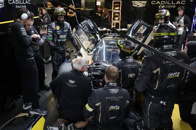 Many team members are working on the Cadillac V Series R 12 Sebastian Bourdias FRA Jack Aitken GBR Earl Bamber NZL due to a stop in the pits due to a technical defect, 24 Hours of Le Mans, France, WEC World Endurance Championship, 14 06 2026, failure analysis,