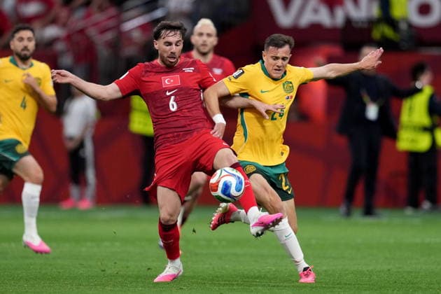 June 13, 2026, Vancouver, Bc, CANADA: Turkey s Orkun Kokcu (6) and Australia s Paul Okon-Engstler (24) vie for control of the ball during first half group D World Cup soccer action, in Vancouver, Saturday, June 13, 2026. AUSTRALIA V. TURKEY  - ZUMAc35_ 20260613_zaf_c35_186 Copyright: xEthanxCairnsx