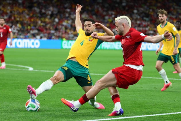 Baris Yilmaz of Turkiye cross is blocked by Jacob Italiano of Australia during the FIFA World Cup, WM, Weltmeisterschaft, Fussball 2026 match between Australia and Turkey at BC Place, Vancouver, Canada on 13 June 2026. Copyright: xPeterxDovganx 45060046