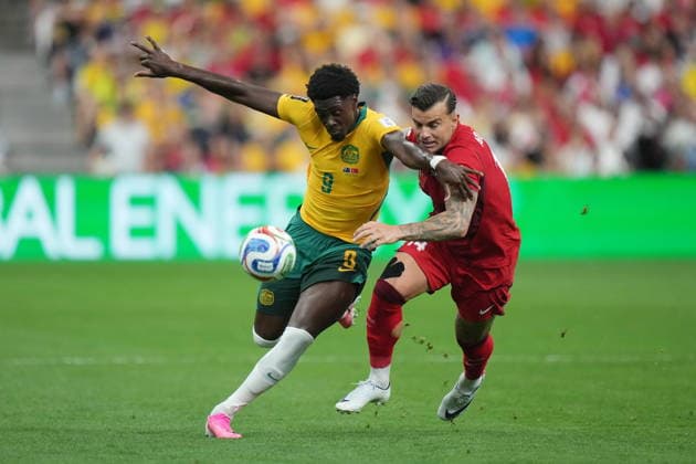 June 13, 2026, Vancouver, Bc, CANADA: Australia s Mohamed Toure (9) and Turkey s Abdulkerim BardakcÄÂ± (14) vie for the ball during the first half of a World Cup Group D soccer match, in Vancouver, on Saturday, June 13, 2026. Canada News - June 13, 2026  - ZUMAc35_ 20260613_zaf_c35_207 Copyright: xDarrylxDyckx