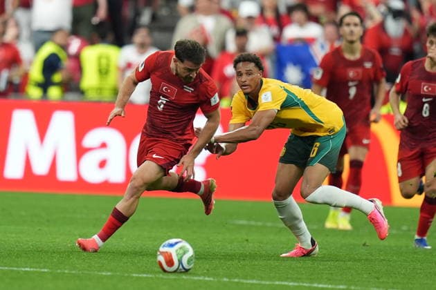Australia v Turkiye - FIFA World Cup, WM, Weltmeisterschaft, Fussball 2026 - Group D VANCOUVER, CANADA - JUNE 13: Salih Ozcan (5) of Turkiye in action against Tete Yengi of Australia during the 2026 FIFA World Cup First Stage Group D match between Australia and Turkiye at BC Place Stadium in Vancouver, Canada on June 13, 2026. Ercin Erturk Anadolu British Columbia Canada. Editorial use only. Please get in touch for any other usage.  Copyright: x2026xAnadoluxErcinxErturkx